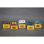 A group of five Matchbox Series diecast model vehicles,