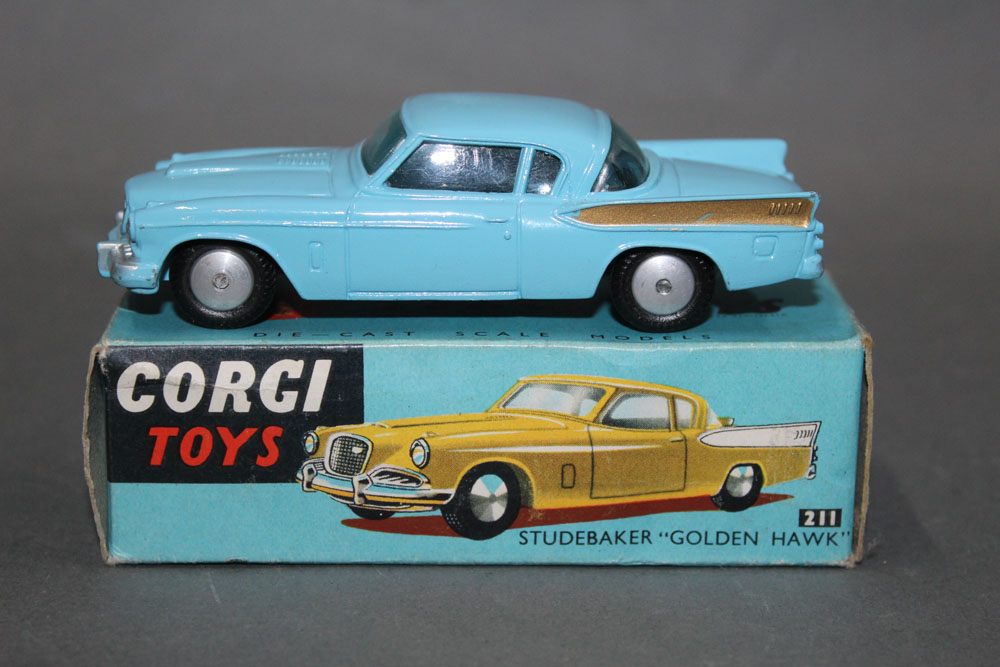 A Corgi Studebaker "Golden Hawk", (211), having a blue body, gold rear wing flashes and flat hubs,