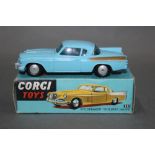 A Corgi Studebaker "Golden Hawk", (211), having a blue body, gold rear wing flashes and flat hubs,