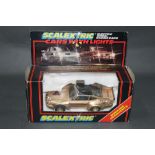 A 1980's Scalextric gold coloured Porsche with lights (C289),