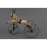 A late 20th century reproduction French wrought and cast iron velocipede, galloping racing horse,