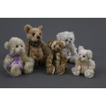Five soft plush Charlie Bears, of varying sizes,