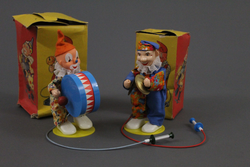 Two 1960s German made pump action musical clowns, manufactured by Sonni,