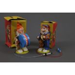 Two 1960s German made pump action musical clowns, manufactured by Sonni,