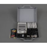 A cased Nintendo Super Nintendo Entertainment System, and sold together with eight games,