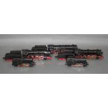A group of five Marklin HO scale steam locomotives, three with tenders,