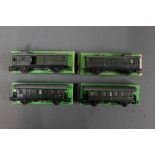 A group of four Marklin HO scale luggage wagons and passenger wagons,