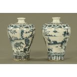 A matched pair of Chinese blue and white porcelain baluster shaped vases of "Windswept" style,