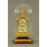 A French brass and porcelain mantle clock, with two train striking movement,