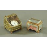 A Victorian embossed brass watch holder,