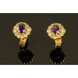 A pair of 18 ct yellow gold amethyst and diamond cluster earrings (see illustration).