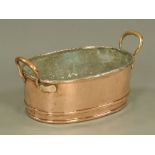 A Victorian copper double handled oval fish kettle, by Gunter & Co. 22 cm high, 47 cm long.