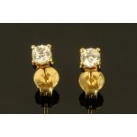 A pair of 18 ct yellow gold diamond stud earrings, diamond weight +/- .43 carats.