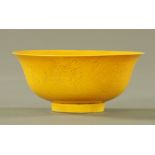 A Chinese yellow enamelled and incised bowl,