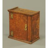 An 18th century oak spice cupboard,