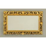 An early 20th century Florentine gilt framed wall mirror. Overall dimensions 71 cm x 44 cm.