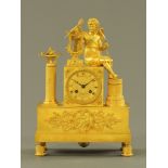 A 19th century Empire gilt clock, with angel and lyre, the dial marked Bartmann a Paris.