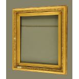 A 19th century gilt rectangular picture frame, with stepped leaf moulded borders.