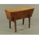 A Victorian oak grain or dough bin, with lift off top and raised on legs of rectangular section.