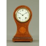 An Edwardian inlaid mahogany balloon shaped mantle clock, with two train striking movement.