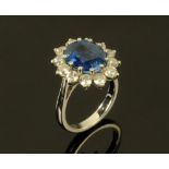 An 18 ct white gold, kyanite and diamond flower head ring,