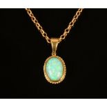 A vintage opal pendant, 2.5 cm x 1.4 cm, 9 ct gold hallmarked and with 9 ct gold chain.