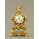 A 19th century French bracket clock, in the rococo style with cherub and lyre terminal,