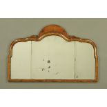 An early 20th century walnut framed Queen Anne style mirror, with three bevelled glass panels.