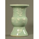 A mid 19th century Chinese celadon porcelain vase, with incised floral white slip.