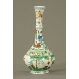 A Chinese Wucai porcelain vase with tall flared neck, decorated with birds and flowers. 30 cm high.