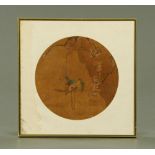 A Chinese painting on silk of a parrot, circular. Diameter 26 cm.