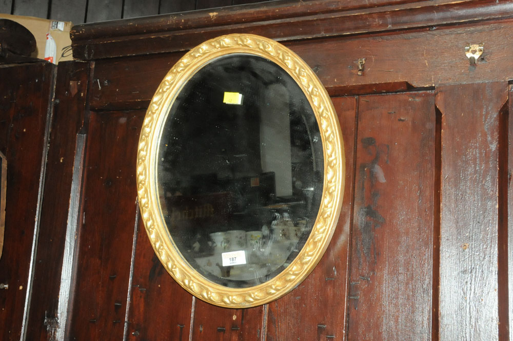 Bevelled edge oval gilt frame mirror