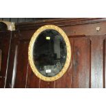 Bevelled edge oval gilt frame mirror