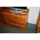 Three drawer pine chest of drawers