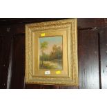 Small landscape oil painting in a gilt frame