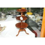 A miniature mahogany dumb waiter