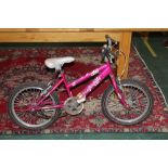 A small pink girls Raleigh bicycle