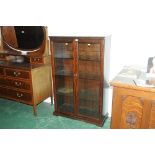 Dark oak display cabinet with glass shelves and light