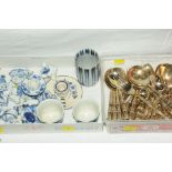Box of cutlery with bamboo style handles and a box of blue and white animal ornaments