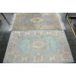 Two patterned rectangular rugs one fringed