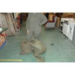 Two bags of army surplus jumpers and canvas bags