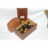 Leather playing card case and a boxed set of chess pieces