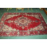 Red patterned fringed rug