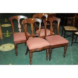 Two pairs of dining chairs with matching fabric