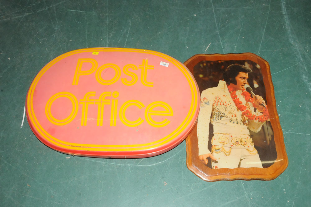 A post office sign and Elvis Presley wall plaque