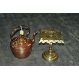 Copper kettle and a brass trivet
