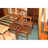 Two pairs of dining chairs with rattan seats