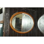 Inlaid wooden framed oval bevelled edge mirror