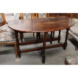 A large mahogany drop leaf gate leg table