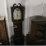 A 19th century oak cased 30 hour longcase clock measuring 220 cm tall